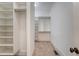 Spacious walk-in closet with shelving, hanging rods, and carpeted floor at 2701 Fountainhead Way, Mount Pleasant, SC 29466