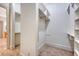 Walk-in closet with shelving and a view to the home's hallway at 2701 Fountainhead Way, Mount Pleasant, SC 29466