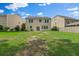 A spacious backyard with lush green grass and a home featuring a sliding glass door entry at 272 Overcup Loop, Summerville, SC 29486