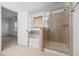 Bright bathroom featuring tile flooring, glass shower, tub and window for natural light at 272 Overcup Loop, Summerville, SC 29486