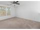 Bright bedroom with neutral carpet, a ceiling fan, and two windows offering plenty of natural light at 272 Overcup Loop, Summerville, SC 29486