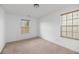 Inviting bedroom with neutral carpet and two bright windows with blinds at 272 Overcup Loop, Summerville, SC 29486