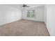 Generous bedroom features a neutral color palette, large window, and plush carpet at 272 Overcup Loop, Summerville, SC 29486