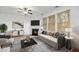 Tastefully staged living room with fireplace, comfortable seating, and modern decor at 272 Overcup Loop, Summerville, SC 29486