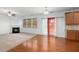 Spacious living area with a fireplace, hardwood floors, and a sliding glass door to the exterior at 272 Overcup Loop, Summerville, SC 29486