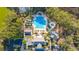 Aerial view of community pool and clubhouse surrounded by trees and parking at 3000 Treadwell St, Mount Pleasant, SC 29466