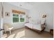 Bright bedroom with natural light, a woven blind, and simple, cozy decor at 3000 Treadwell St, Mount Pleasant, SC 29466