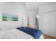 Neutral bedroom with ensuite bathroom featuring a closet and an art piece on the wall at 3000 Treadwell St, Mount Pleasant, SC 29466
