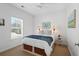 Inviting bedroom with a window, side tables with wicker lamps, and underbed storage baskets at 3000 Treadwell St, Mount Pleasant, SC 29466