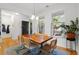 Charming dining room with hardwood floors, modern lighting, and outdoor views at 3000 Treadwell St, Mount Pleasant, SC 29466