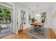 Bright dining room features hardwood floors, natural light, and a stylish rug at 3000 Treadwell St, Mount Pleasant, SC 29466