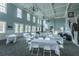 Large event space with tables and chairs, offering a versatile setting for gatherings and celebrations at 3000 Treadwell St, Mount Pleasant, SC 29466