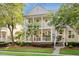 Charming two-story home featuring a double porch, manicured landscaping, and a welcoming entrance at 3000 Treadwell St, Mount Pleasant, SC 29466