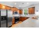 Beautiful kitchen with stainless appliances, wood cabinets, and counter seating at 3000 Treadwell St, Mount Pleasant, SC 29466