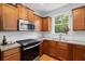 Well-equipped kitchen with stainless steel appliances, ample cabinets, and a view to the backyard at 3000 Treadwell St, Mount Pleasant, SC 29466