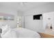 Bright main bedroom with closet space, TV, and ensuite bathroom at 3000 Treadwell St, Mount Pleasant, SC 29466