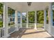 Covered patio with brick flooring and white columns offering a shaded and stylish outdoor space at 3000 Treadwell St, Mount Pleasant, SC 29466