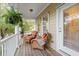 Cozy front porch with comfortable wicker chairs and a peaceful setting at 3000 Treadwell St, Mount Pleasant, SC 29466