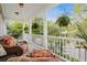 Covered porch view features chairs and views of the neighborhood at 3000 Treadwell St, Mount Pleasant, SC 29466