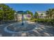 Community splash pad for children surrounded by lounge chairs, offering a fun and relaxing environment at 3000 Treadwell St, Mount Pleasant, SC 29466