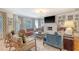 Cozy living room with a fireplace, comfortable seating, and natural light at 304 Bank St, Mount Pleasant, SC 29464