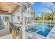 Inviting pool area with an outdoor bar, loungers, and an umbrella, perfect for relaxation at 304 Bank St, Mount Pleasant, SC 29464