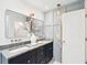 Transitional bathroom featuring a modern double vanity, attractive lighting, and neutral decor at 313 E Arctic Ave, Folly Beach, SC 29439