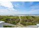 Sandy beach landscape with natural dunes vegetation and a view of the ocean at 313 E Arctic Ave, Folly Beach, SC 29439