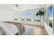 Bright bedroom offers stunning ocean views, lots of natural light, and modern design at 313 E Arctic Ave, Folly Beach, SC 29439