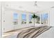 This bright bedroom offers stunning ocean views, lots of natural light, and modern design at 313 E Arctic Ave, Folly Beach, SC 29439