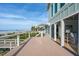Spacious wooden deck offering stunning ocean views through sliding glass doors at 313 E Arctic Ave, Folly Beach, SC 29439