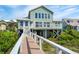 Coastal home with a private walkway to the beach and an upper level deck at 313 E Arctic Ave, Folly Beach, SC 29439