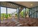 View of the lower level of the home with a walkway to the beach, natural foliage, and open space at 313 E Arctic Ave, Folly Beach, SC 29439