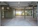 Spacious lower level garage area with exposed support beams and natural light at 313 E Arctic Ave, Folly Beach, SC 29439