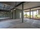 Open garage area with columns, ample space, and a view of the coastal landscape at 313 E Arctic Ave, Folly Beach, SC 29439