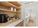 Modern kitchen features a coffee bar, custom cabinets with open shelves, and lots of room for storage and food prep at 313 E Arctic Ave, Folly Beach, SC 29439