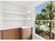 A charming nook with a view showcases the kitchen's stylish cabinetry, countertops, and sun-drenched natural light at 313 E Arctic Ave, Folly Beach, SC 29439