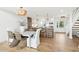 Modern kitchen features island seating and opens to the dining and living areas, creating a welcoming atmosphere at 313 E Arctic Ave, Folly Beach, SC 29439