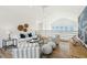 Bright, open-concept living room offers great views and comfortable seating arrangements at 313 E Arctic Ave, Folly Beach, SC 29439