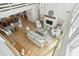 Open-concept living and dining area with modern furnishings, light-filled space, and wooden floors at 313 E Arctic Ave, Folly Beach, SC 29439
