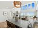 Coastal home features a spacious living area with large windows offering beautiful views, perfect for relaxing and entertaining at 313 E Arctic Ave, Folly Beach, SC 29439