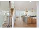 Bright, open-concept living area featuring a modern kitchen, a cozy seating area, and scenic ocean views at 313 E Arctic Ave, Folly Beach, SC 29439