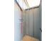 Outdoor shower room with wood floors, a modern fixture, and colorful pipes at 313 E Arctic Ave, Folly Beach, SC 29439