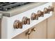 Close-up of a high-end stove with sleek design, showcasing the modern knobs and detailing of the appliance at 313 E Arctic Ave, Folly Beach, SC 29439