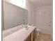 Bathroom with tile floors, combination tub and shower, large mirror, and vanity at 3254 Hartwell St, Johns Island, SC 29455