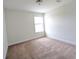 A sunlit bedroom features plush carpeting, freshly painted walls and a bright window at 3254 Hartwell St, Johns Island, SC 29455