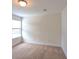 A bright bedroom is shown with neutral carpet, fresh paint and a window at 3254 Hartwell St, Johns Island, SC 29455