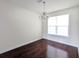 Classic dining room with hardwood floors, a stylish chandelier, and a bright window at 3254 Hartwell St, Johns Island, SC 29455