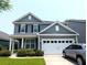 Charming two-story home with gray siding, a two-car garage, and well-maintained landscaping at 3254 Hartwell St, Johns Island, SC 29455