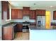 Spacious kitchen featuring granite countertops, stainless steel appliances, and dark wood cabinets at 3254 Hartwell St, Johns Island, SC 29455